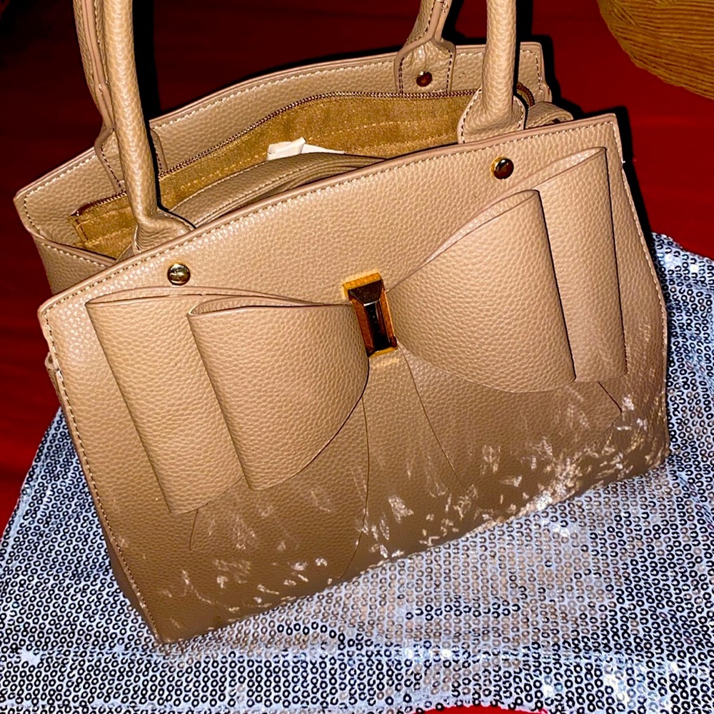Tan Purse long strap .,